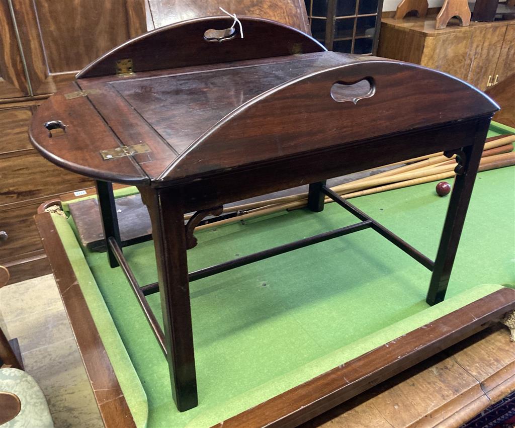 A Victorian mahogany folding butlers tray, width 90cm depth 78cm, on later stand